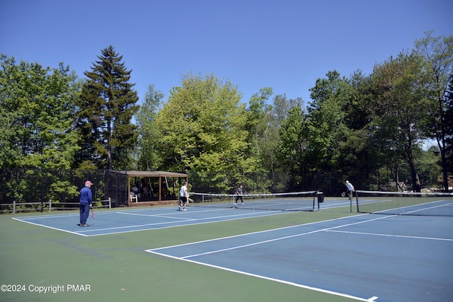 view of tennis court with fence