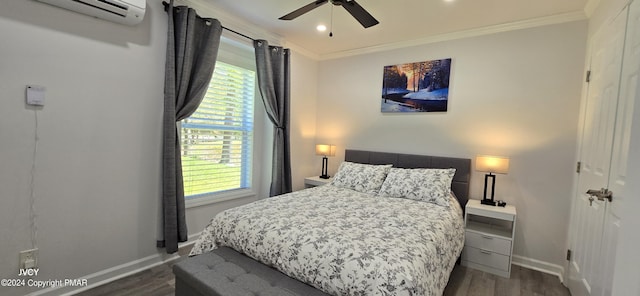 bedroom with baseboards, crown molding, and wood finished floors