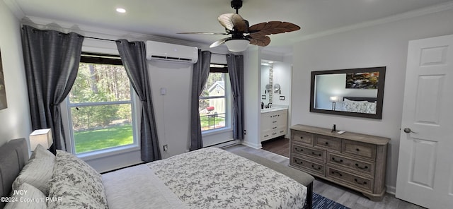 bedroom with a ceiling fan, ornamental molding, an AC wall unit, and wood finished floors