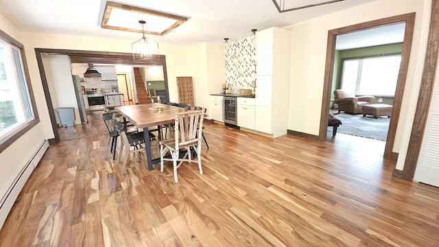104 Haverhill Rd, Buck Hill Falls, PA 18323 - dining area with a baseboard radiator, beverage cooler, healthy amount of natural light, and light wood finished floors