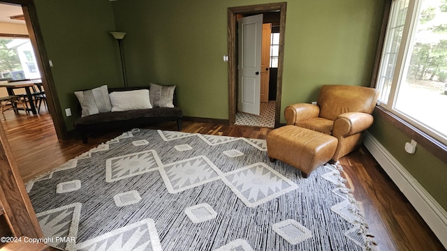 104 Haverhill Rd, Buck Hill Falls, PA 18323 - living area featuring wood finished floors and a baseboard radiator