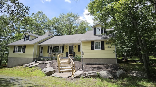 104 Haverhill Rd, Buck Hill Falls, PA 18323 - cape cod-style house featuring covered porch, a chimney, and stairway