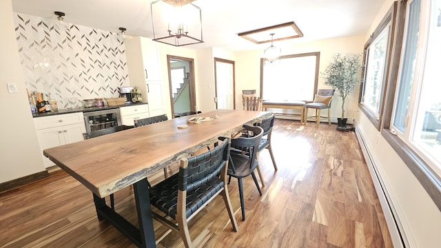 104 Haverhill Rd, Buck Hill Falls, PA 18323 - kitchen with wine cooler, dark countertops, white cabinets, and light wood-type flooring