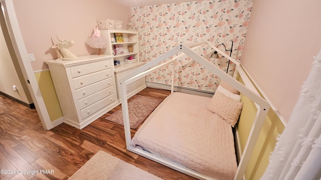 104 Haverhill Rd, Buck Hill Falls, PA 18323 - bedroom featuring a baseboard radiator and wood finished floors