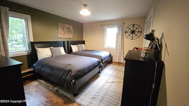 104 Haverhill Rd, Buck Hill Falls, PA 18323 - bedroom with multiple windows and wood finished floors