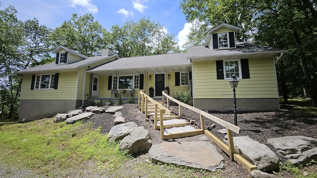 104 Haverhill Rd, Buck Hill Falls, PA 18323 - view of front facade featuring covered porch and a chimney