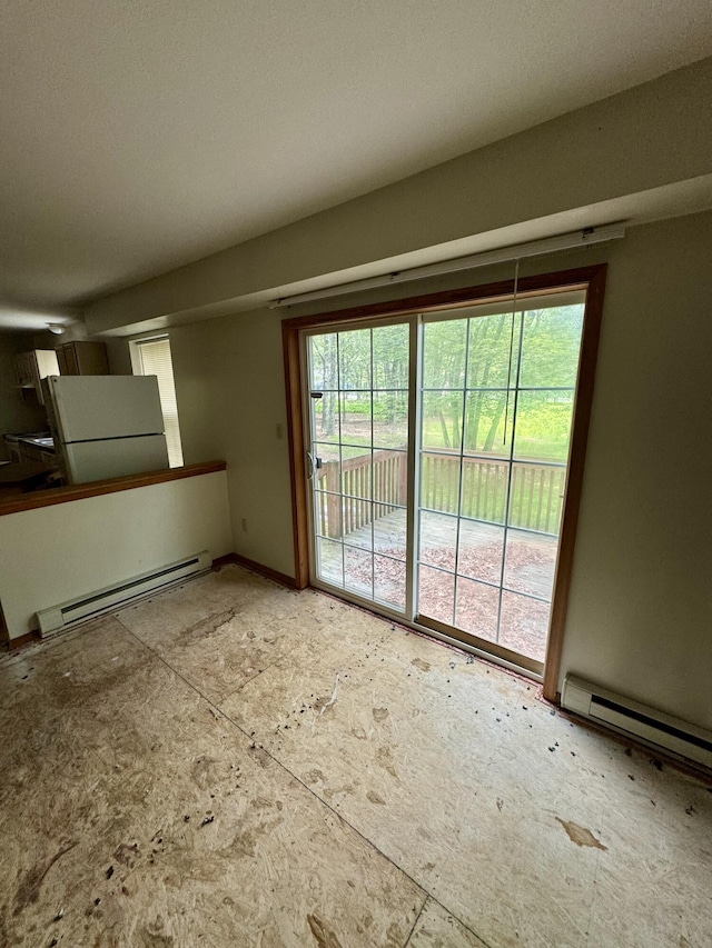 2149 Valley View Dr, Bushkill, PA 18324 - empty room with a baseboard heating unit and plenty of natural light