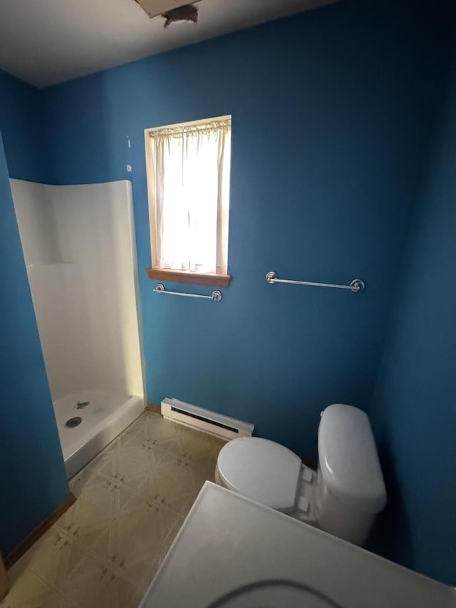2149 Valley View Dr, Bushkill, PA 18324 - full bathroom with baseboard heating, a stall shower, and tile patterned floors