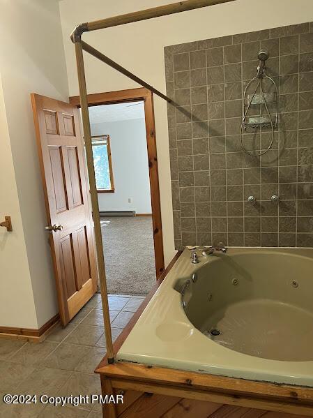 full bathroom featuring baseboards and tile patterned floors