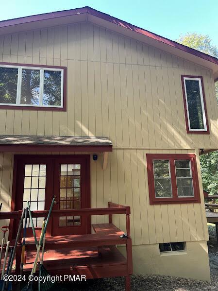 back of house with crawl space