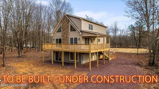 back of property featuring stairway and a wooden deck