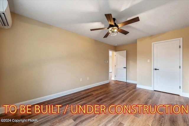 84 Parker Trl, Albrightsville, PA 18210 - unfurnished bedroom with baseboards, a wall unit AC, wood finished floors, and a ceiling fan