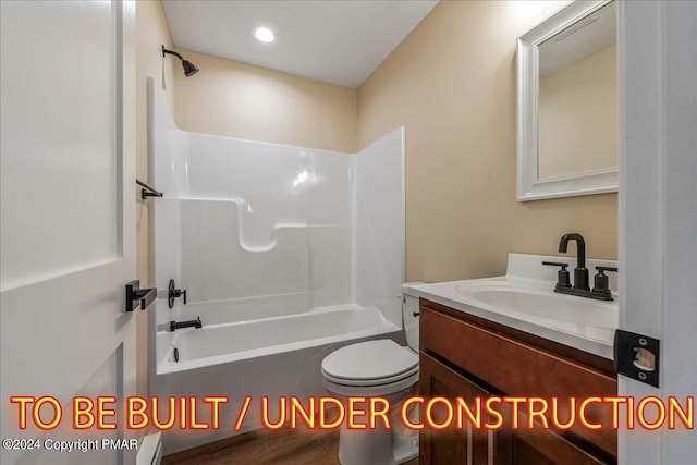 84 Parker Trl, Albrightsville, PA 18210 - bathroom with toilet, bathing tub / shower combination, a baseboard heating unit, and vanity