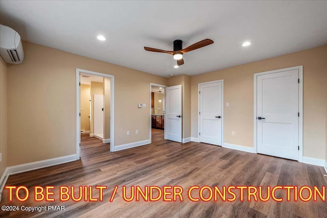 84 Parker Trl, Albrightsville, PA 18210 - unfurnished bedroom featuring baseboards, wood finished floors, and an AC wall unit