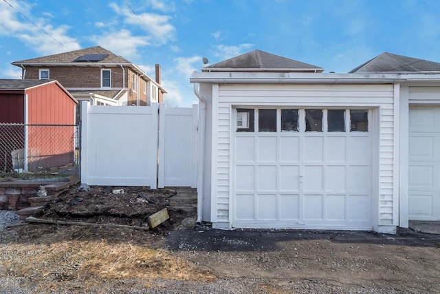 garage featuring fence