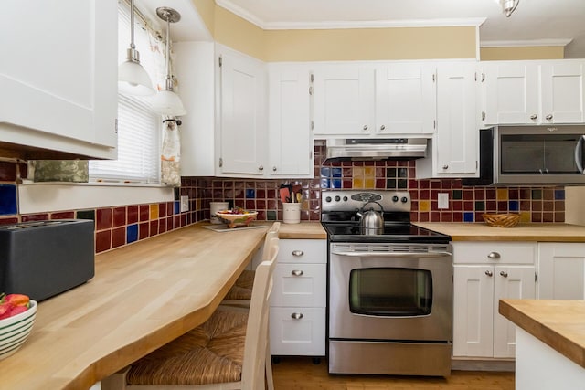 kitchen with under cabinet range hood, wood counters, backsplash, stainless steel appliances, and crown molding