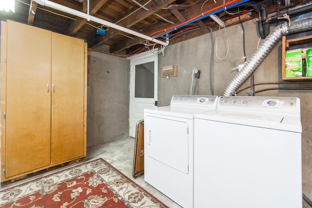 laundry room featuring washer and dryer and laundry area