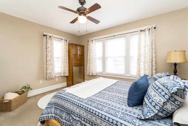 bedroom featuring baseboards, carpet, and a ceiling fan