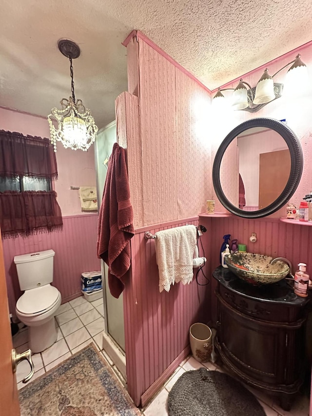 6069 Boardwalk Dr, Tobyhanna, PA 18466 - full bathroom with toilet, a chandelier, a shower stall, wood walls, and a textured ceiling