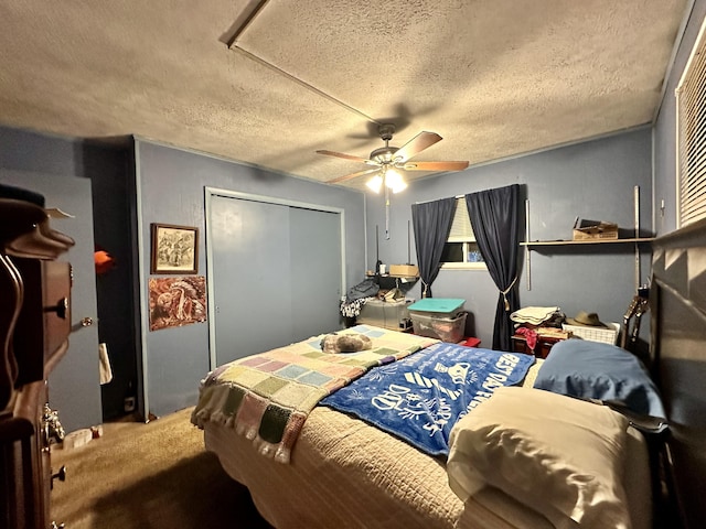 6069 Boardwalk Dr, Tobyhanna, PA 18466 - bedroom with a textured ceiling, carpet flooring, a closet, and a ceiling fan