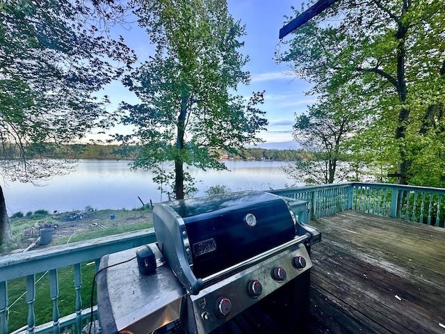 6069 Boardwalk Dr, Tobyhanna, PA 18466 - wooden terrace featuring a grill and a water view