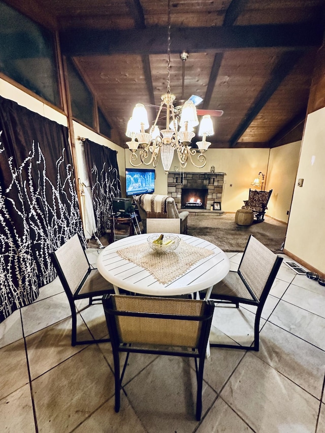 6069 Boardwalk Dr, Tobyhanna, PA 18466 - dining area featuring a chandelier, wood ceiling, and a stone fireplace