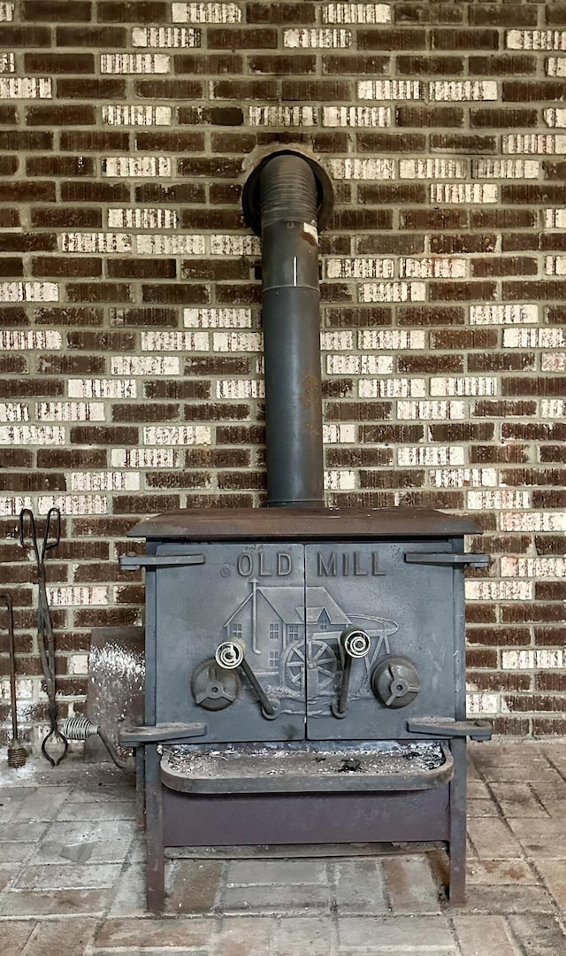 6069 Boardwalk Dr, Tobyhanna, PA 18466 - detailed view of a wood stove and brick wall