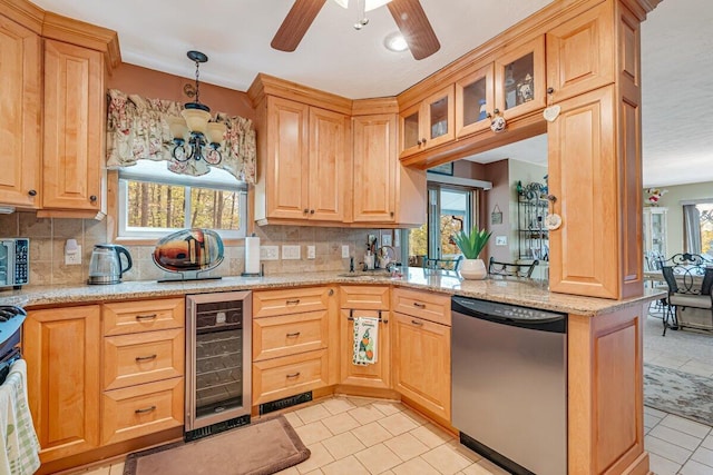 176 Manchester Dr, Bushkill, PA 18324 - kitchen featuring dishwasher, wine cooler, a chandelier, and backsplash