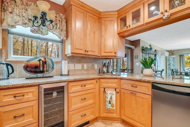 176 Manchester Dr, Bushkill, PA 18324 - kitchen with beverage cooler, stainless steel dishwasher, light stone counters, decorative backsplash, and light tile patterned floors