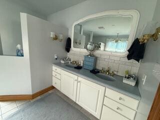 163 Wagner Blvd, Greenfield Township, PA 18407 - bathroom featuring a sink and decorative backsplash