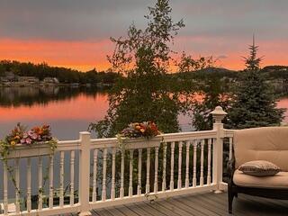163 Wagner Blvd, Greenfield Township, PA 18407 - deck at dusk featuring a water view
