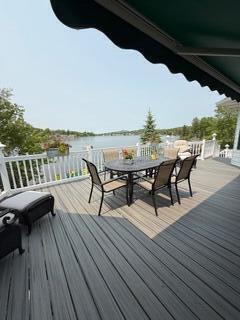 163 Wagner Blvd, Greenfield Township, PA 18407 - wooden terrace with outdoor dining space and a water view