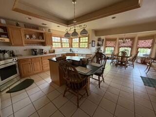 163 Wagner Blvd, Greenfield Township, PA 18407 - dining room featuring a tray ceiling and light tile patterned flooring