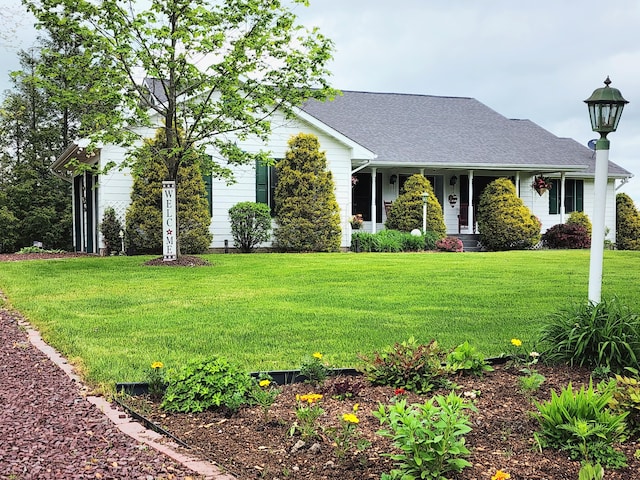 163 Wagner Blvd, Greenfield Township, PA 18407 - view of front of home featuring a front lawn, roof with shingles, and covered porch