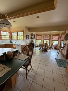 163 Wagner Blvd, Greenfield Township, PA 18407 - dining room featuring plenty of natural light, light tile patterned flooring, and a chandelier