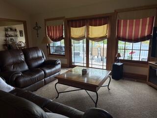 163 Wagner Blvd, Greenfield Township, PA 18407 - living room featuring light carpet and baseboards