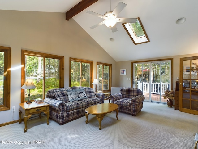 5310 Conoquenissing Dr, Pocono Lake, PA 18347 - carpeted living area with a skylight, beam ceiling, a ceiling fan, high vaulted ceiling, and baseboards