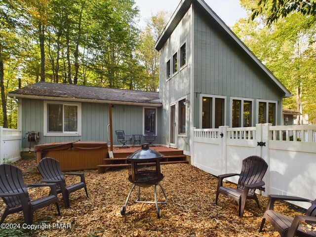 5310 Conoquenissing Dr, Pocono Lake, PA 18347 - back of property featuring a gate, fence, a hot tub, and a wooden deck