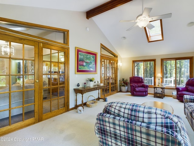 5310 Conoquenissing Dr, Pocono Lake, PA 18347 - living room featuring a skylight, french doors, beam ceiling, a ceiling fan, and carpet flooring