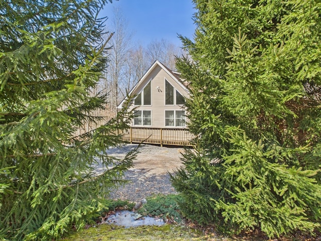 view of side of property featuring a deck