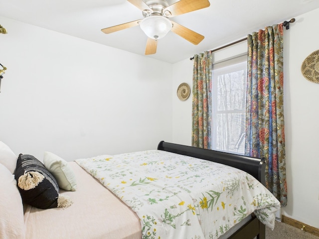 carpeted bedroom with a ceiling fan