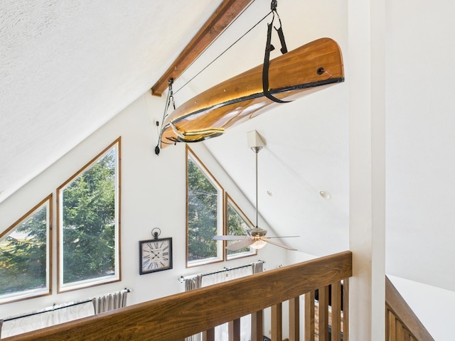 details featuring beamed ceiling and ceiling fan