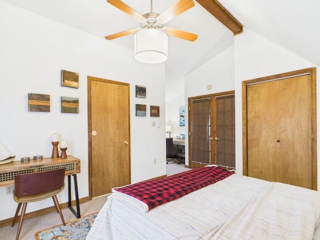 carpeted bedroom featuring ceiling fan, baseboards, multiple closets, beam ceiling, and high vaulted ceiling