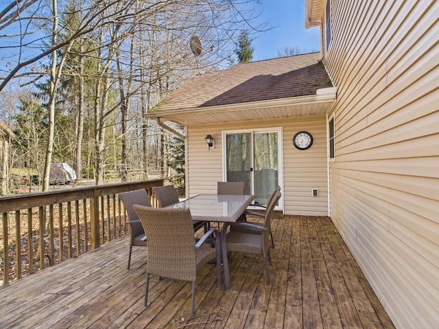 deck featuring outdoor dining area