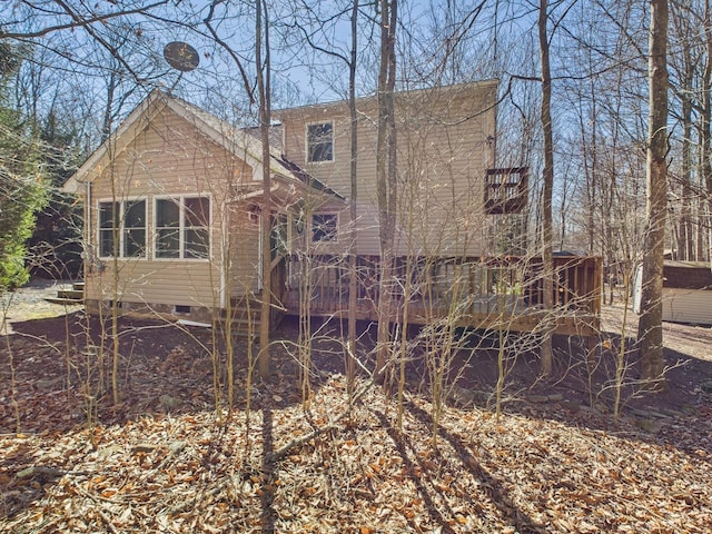 back of house featuring crawl space