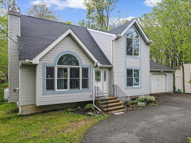 822 Trafalgar Rd, Tobyhanna, PA 18466 - view of front of home with a chimney, driveway, roof with shingles, and a garage