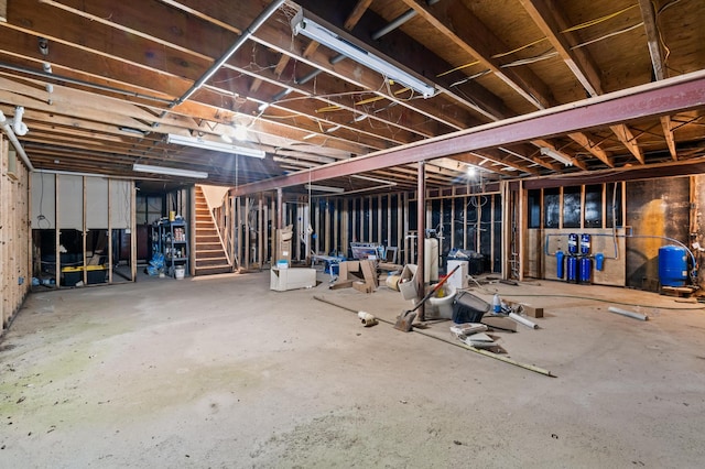 109 Little Doe Ln, East Stroudsburg, PA 18301 - unfinished below grade area with stairway and a water pressure tank