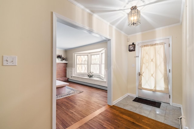 109 Little Doe Ln, East Stroudsburg, PA 18301 - entrance foyer with ornamental molding, a baseboard heating unit, a chandelier, and wood-type flooring