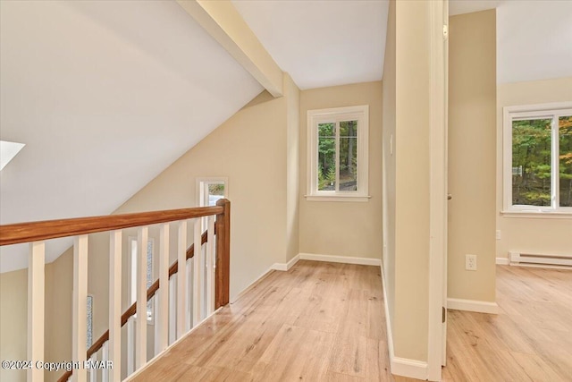 bonus room featuring a wealth of natural light, baseboards, vaulted ceiling with beams, and light wood finished floors