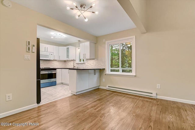 kitchen with electric stove, decorative backsplash, baseboard heating, white microwave, and white cabinets